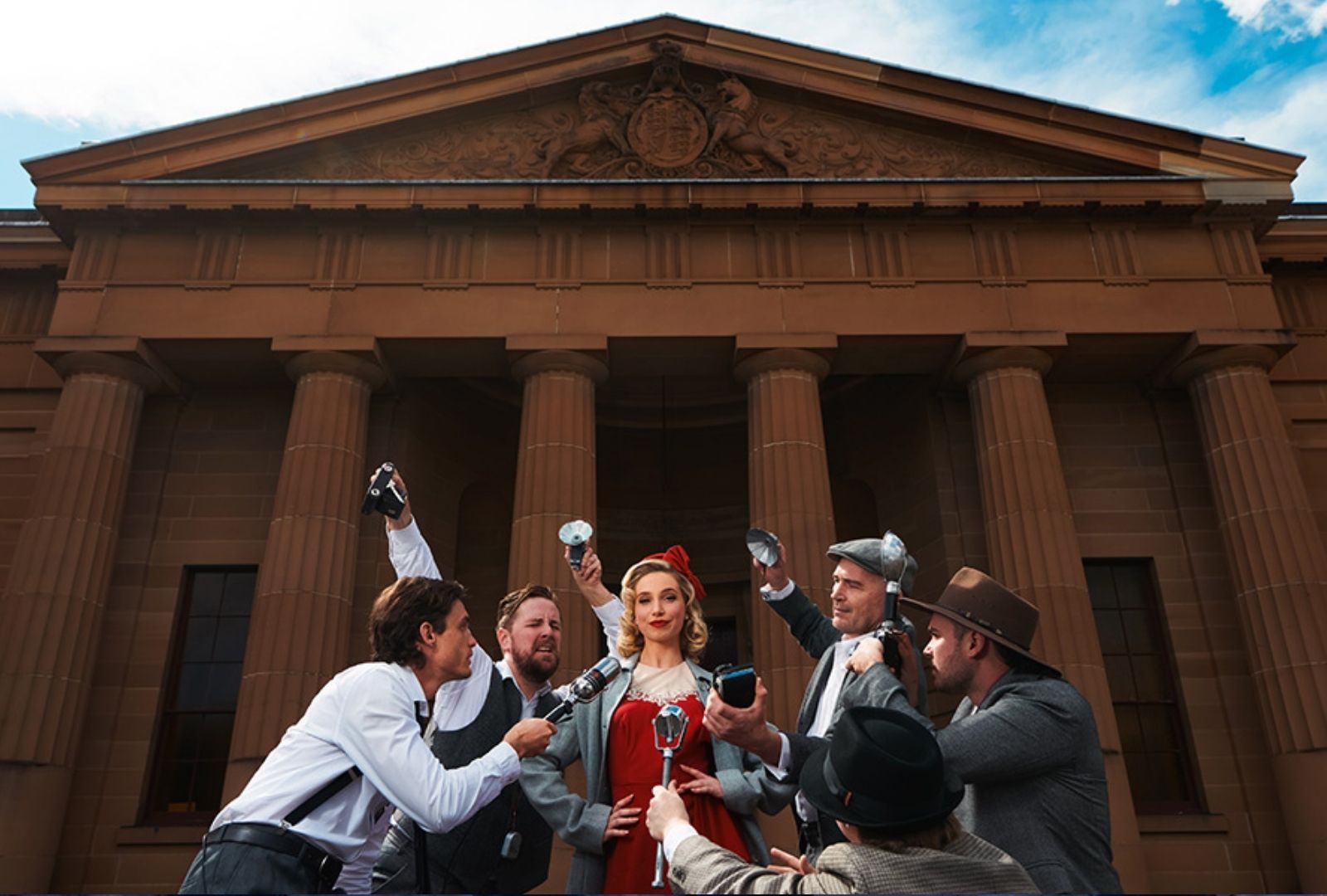 Journalists outside a courthouse interviewing a suspected criminal.